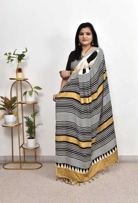 Elegant Cream Saree with Black Polka Dots & Golden Designer Border